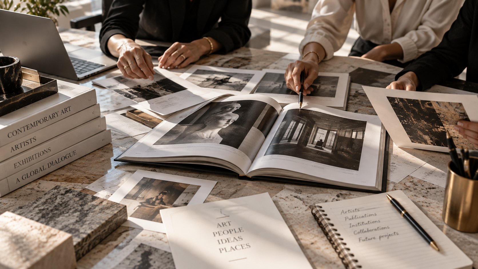 Art professionals reviewing contemporary art publications